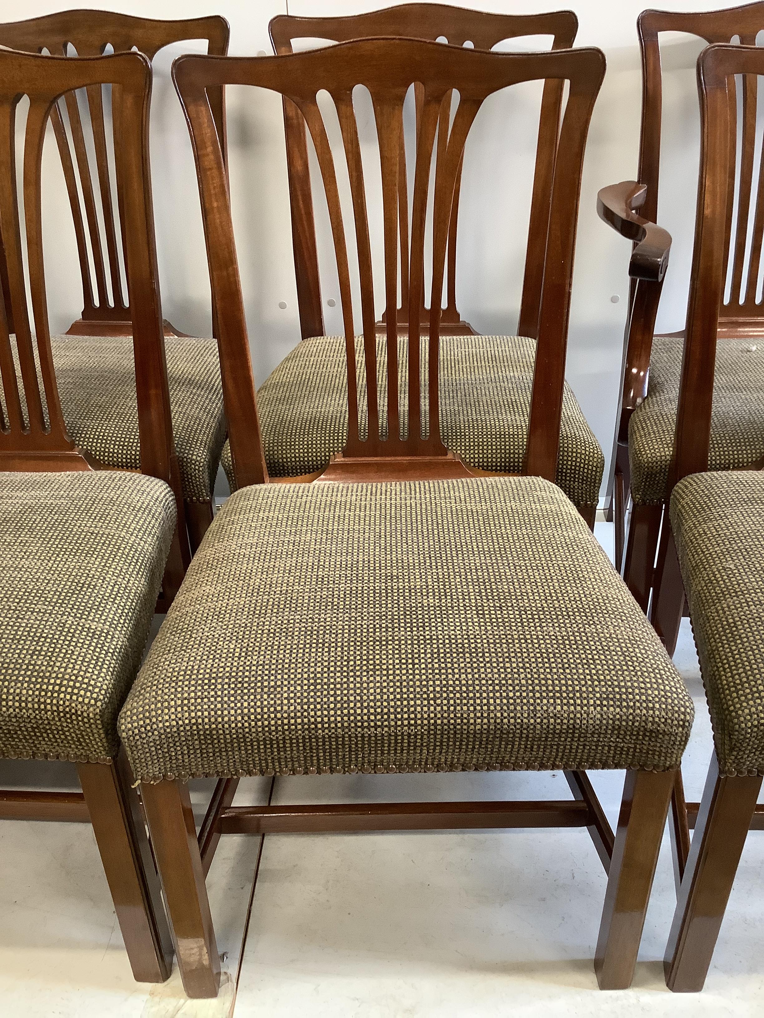 A set of twelve reproduction George III style mahogany dining chairs, ten single, two elbow chairs